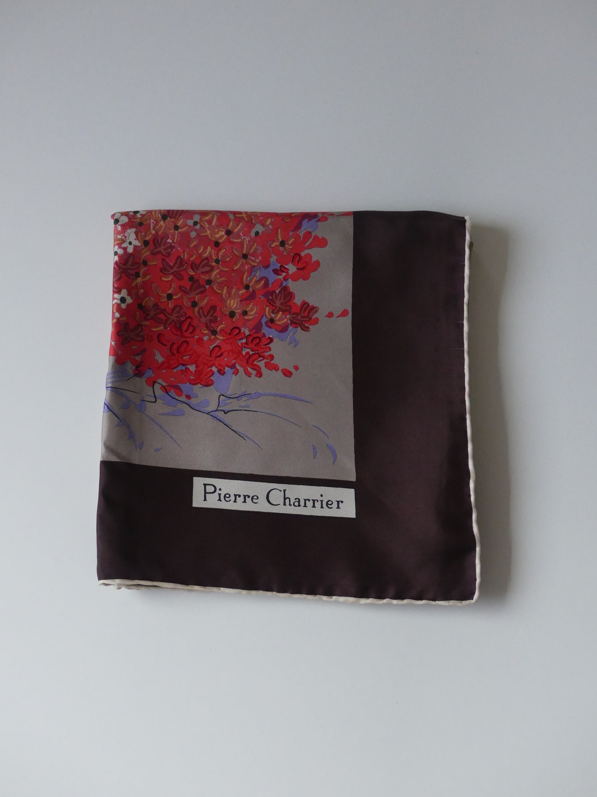 Shop the Pierre Charrier Sakura Blossom Silk Carré, featuring delicate sakura flowers and a refined brown border. A luxurious accessory that adds timeless elegance to your wardrobe. Perfect for any occasion.
