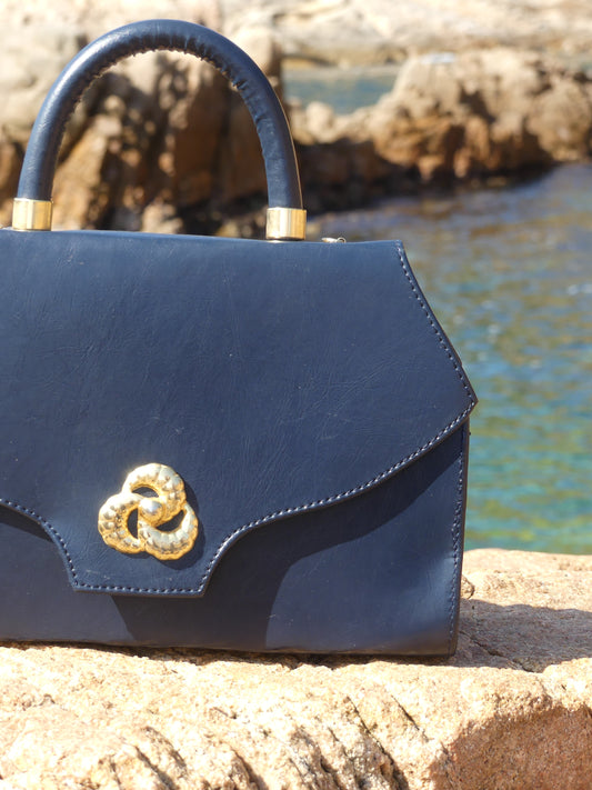 Whether you’re heading to a seaside escape or a city stroll, the Blava Vintage Handbag is your go-to piece for effortless sophistication. Each piece is unique—part of a carefully curated vintage collection from La Vague Vintage.